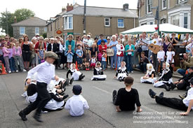 Children at the Goldsithney Charter Fayre playing Barley Bread in traditional costumes