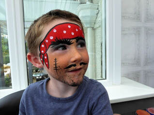 Parents learning Face Painting skills at Funny Faces workshops for Cornwall Library Service.